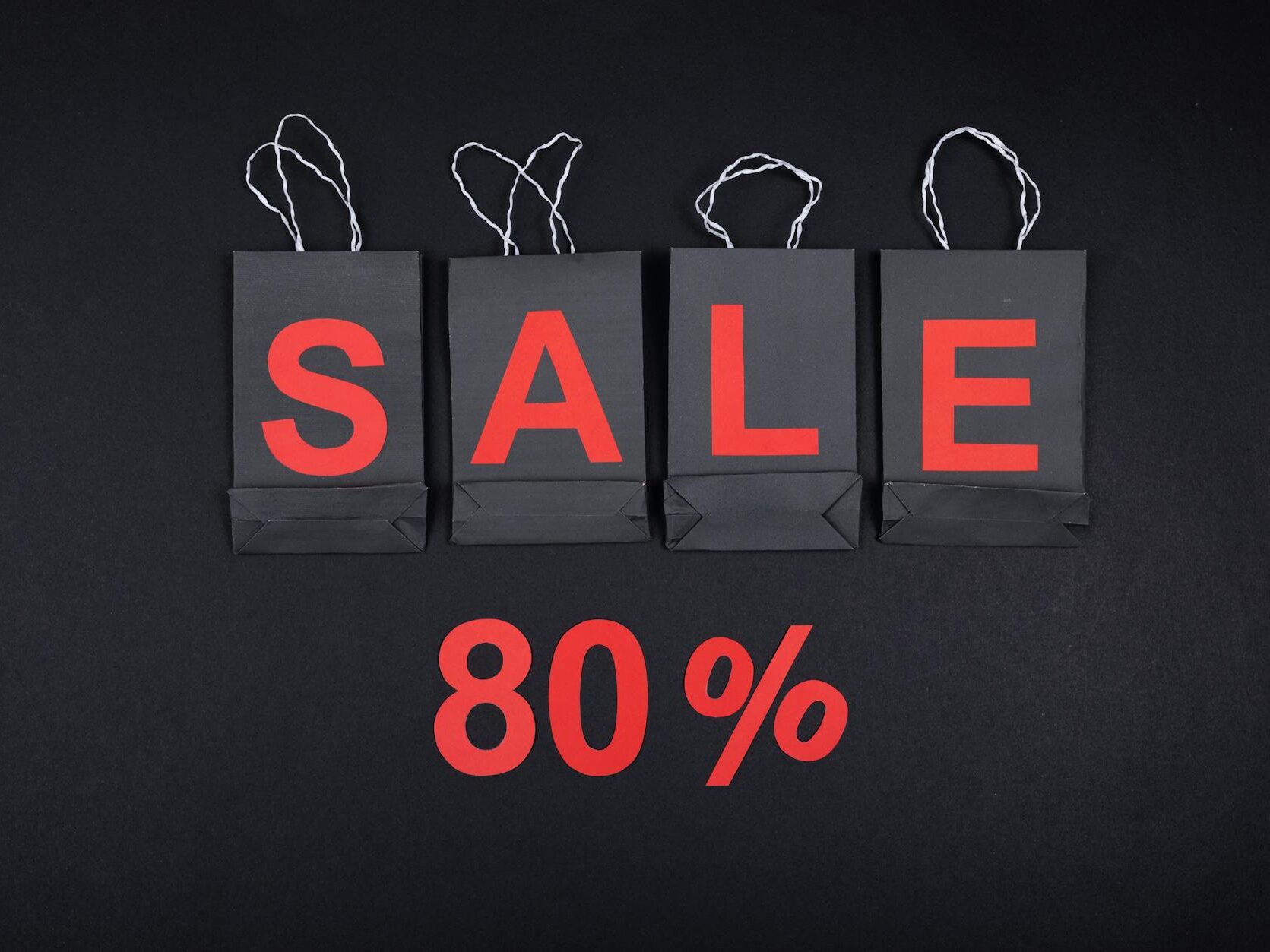 sale sign made from paper shopping bags